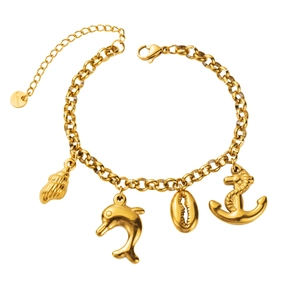 Macro shot of gold stainless steel ocean charms including shell, dolphin, and anchor