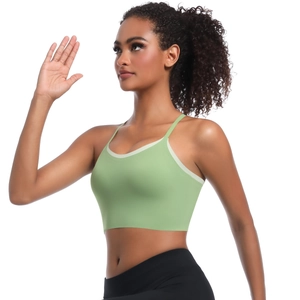 Women's light green racerback yoga bra with contrast straps and professional fit