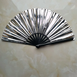 Detail of silver laser film folding fan with black bamboo ribs on marble surface