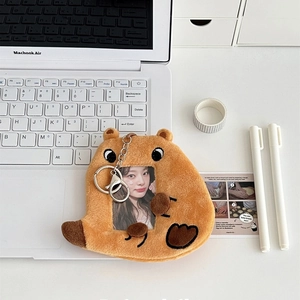 Detail of plush capybara photo card holder with metal lobster clasp and clear window
