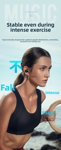 Macro detail of ergonomic black ear-clip wireless earphone worn during outdoor activities