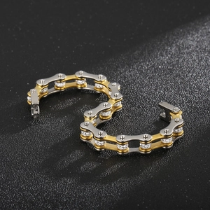 Macro shot of two-tone steel motorcycle chain bracelet with inlaid sparkling rhinestones