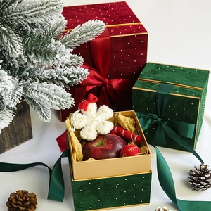 Velvet Christmas gift boxes in red and green with polka dots and satin ribbon bows