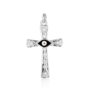 Macro detail of silver cross pendant with evil eye motif and cubic zirconia stones