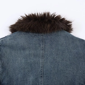 Detailed back view of dark blue denim jacket showing faux fur collar and seam stitching