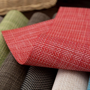 Thick woven PVC placemat in red featuring heat-resistant and waterproof textures