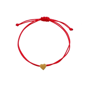 Minimalist red cord woven bracelet with a polished gold heart pendant and adjustable sliding knot