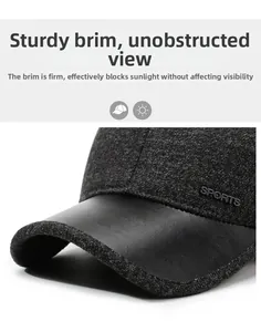 Detail of winter baseball cap showing thick tweed fabric and leather brim with SPORTS logo