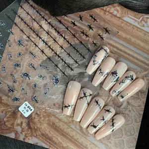 Japanese style black thorn nail art stickers on nude base for elegant manicure