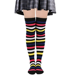 Colorful striped over-the-knee socks with vibrant black pink yellow and blue patterns