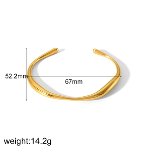 Detail view of wavy 18k gold plated stainless steel cuff bracelet with 14.2g weight