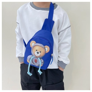 Detail of royal blue kids crossbody bag featuring a cute cartoon bear with hoodie