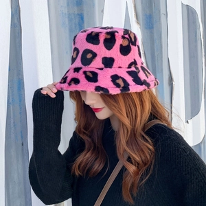 Detailed texture of plush leopard print faux fur bucket hat in pink for autumn winter