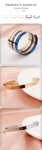 Close-up of 6mm polished stainless steel C-shaped open bracelets in multiple colors