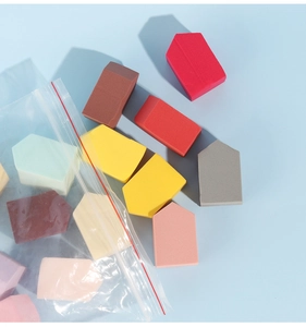 Detail of colorful latex-free triangle makeup sponges with transparent zipper storage bag
