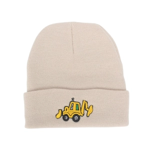 Close-up of beige knit beanie featuring a yellow excavator embroidery on the folded cuff