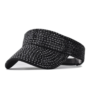 Detailed view of luxury black sun visor with shimmering rhinestones on fabric