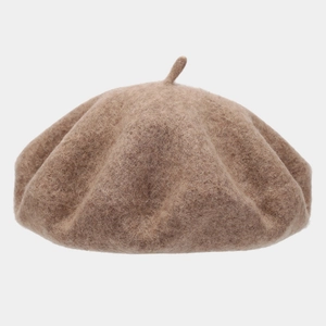 Detailed texture of thick wool beret featuring a vintage khaki fuzzy felt finish and top stem
