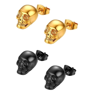Detail view of gothic skull earrings in polished gold and matte black finish