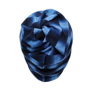 Detail of blue and black zigzag knit pattern on soft fleece thermal neck warmer