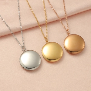 Detailed view of polished mirror-finish round lockets in silver, gold, and rose gold