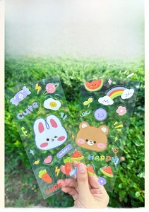 Waterproof cartoon PET stickers featuring cute rabbit and bear designs for DIY decor