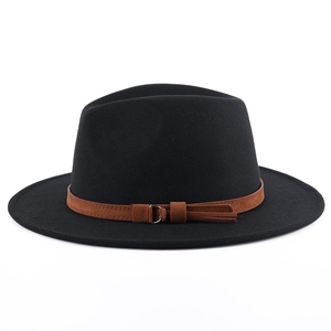 Detail of black wool fedora featuring a brown suede band with metal ring and twin tassels