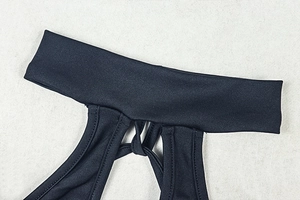 Detail of black halter neckline and high-stretch knit fabric with fine stitching