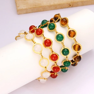 Minimalist round bead bracelets with colorful stone inlays in golden settings