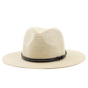 Close-up of beige straw jazz hat featuring a black leather band with silver metal studs
