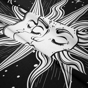 Detailed macro view of bohemian sun and moon tapestry with high-quality printing texture
