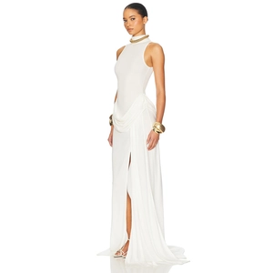 Detail view of white sleeveless high-neck maxi dress with waist pleats and side high slit