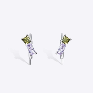 Detailed shot of silver earrings with rectangular purple and square yellow zircon stones