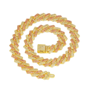 Close-up of 15mm gold Cuban chain link necklace with pink and white rhinestones