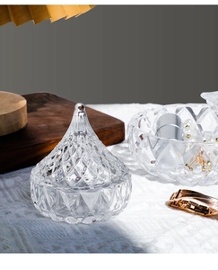 Detail showing crystal-textured glass jewelry jar and tray set with diamond engraving