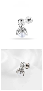Macro shot of silver octopus stud earring with white pearl and spiral back closure