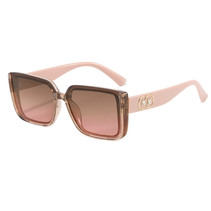 Gafas de sol oversize rosa degradado con detalle de círculo dorado en la patilla mujer