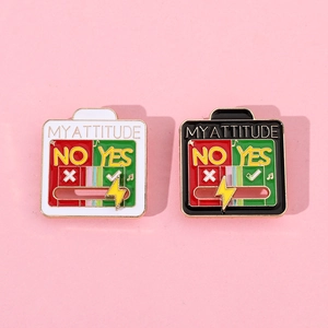 Detail view of the sliding mood brooch showing My Attitude text on a pink background