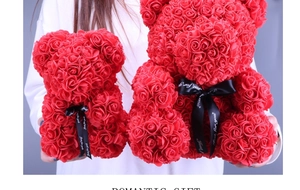 Detail of red foam rose teddy bears in two sizes held by hands for Valentine's Day gift