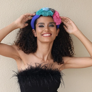 Handmade fabric floral headband with blue base and vibrant colorful tassels for women