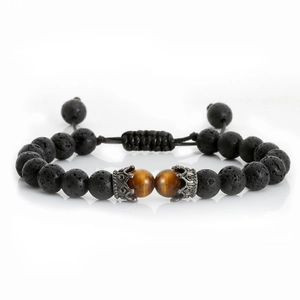 Macro detail of men's crown bracelet with black lava rock and brown tiger eye stone beads