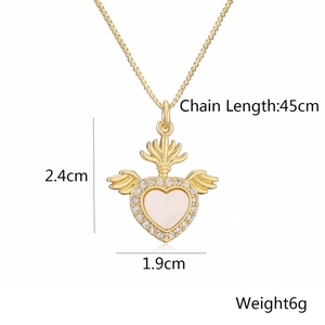 Detail view of 18K gold plated heart pendant with white zircons and wings dimension labels