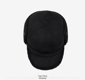 Top view of a black winter trapper hat with faux suede finish and warm fleece lining
