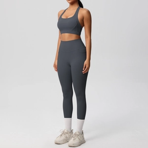 Side view of charcoal grey yoga set featuring high-waisted leggings with side pockets