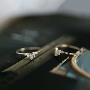 Macro shot of s925 silver crown ring with marquise-cut zircons and gold-plated finish