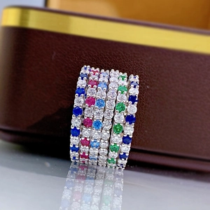 Macro shot of S925 silver row rings with colorful gemstones and fine diamond setting