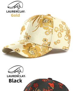 Detail of floral jacquard embroidery on luxury gold and black baseball caps