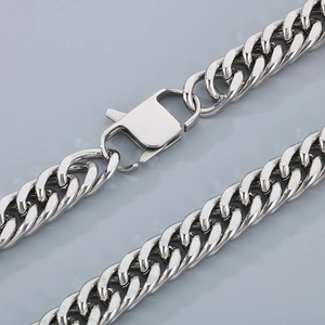 Macro shot of silver stainless steel Cuban chain link with secure lobster clasp detail