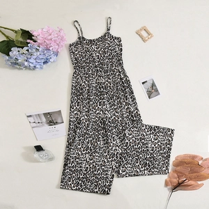 Flat lay of leopard print backless jumpsuit with spaghetti straps and wide leg fit