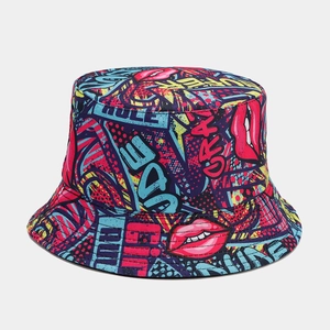Detailed view of pop art graffiti print featuring stars and bold red lip on bucket hat